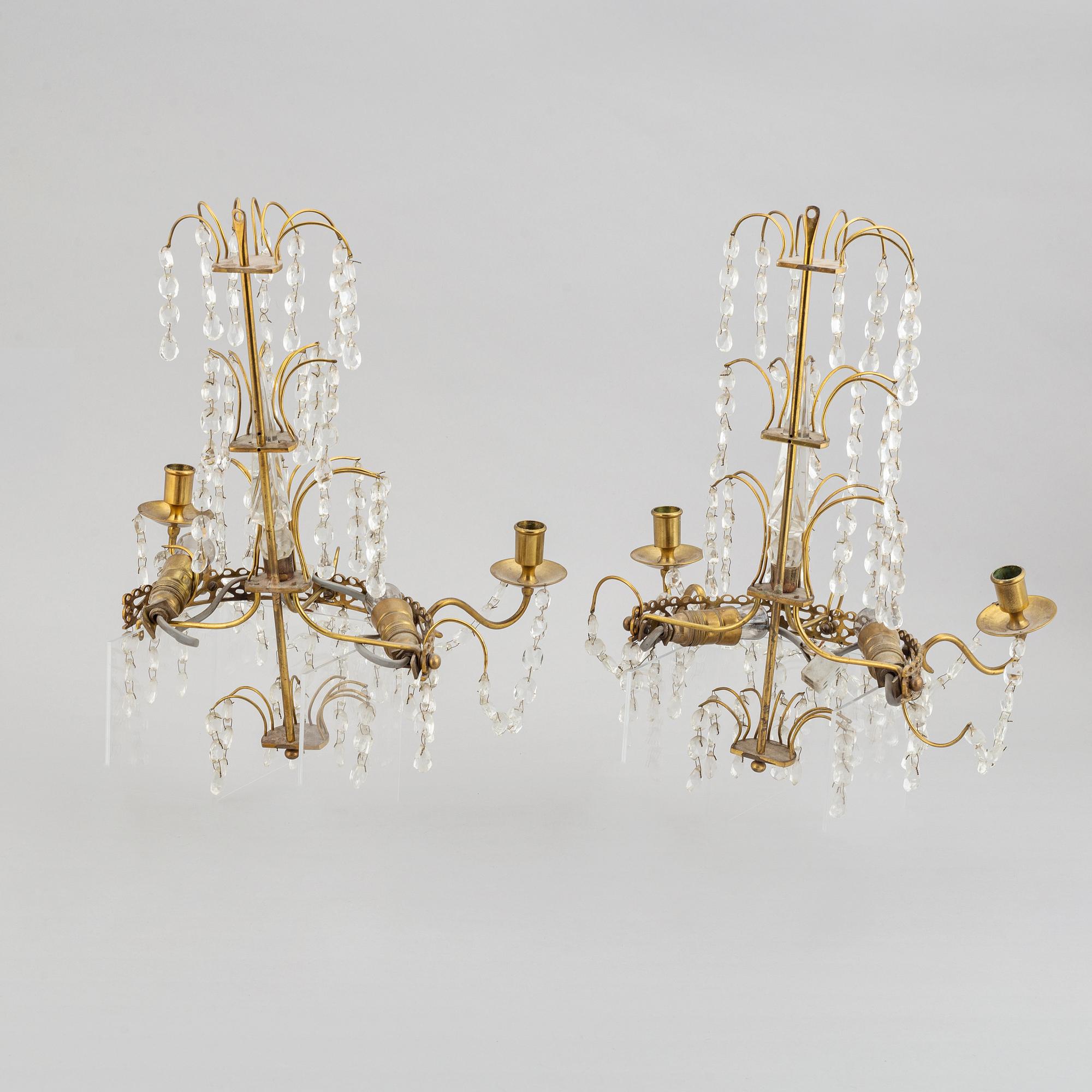 A pair of brass wall sconces, first half of the 20th century.