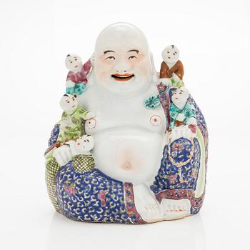 A Chinese porcelain laughing Buddha with children, the 20th century.