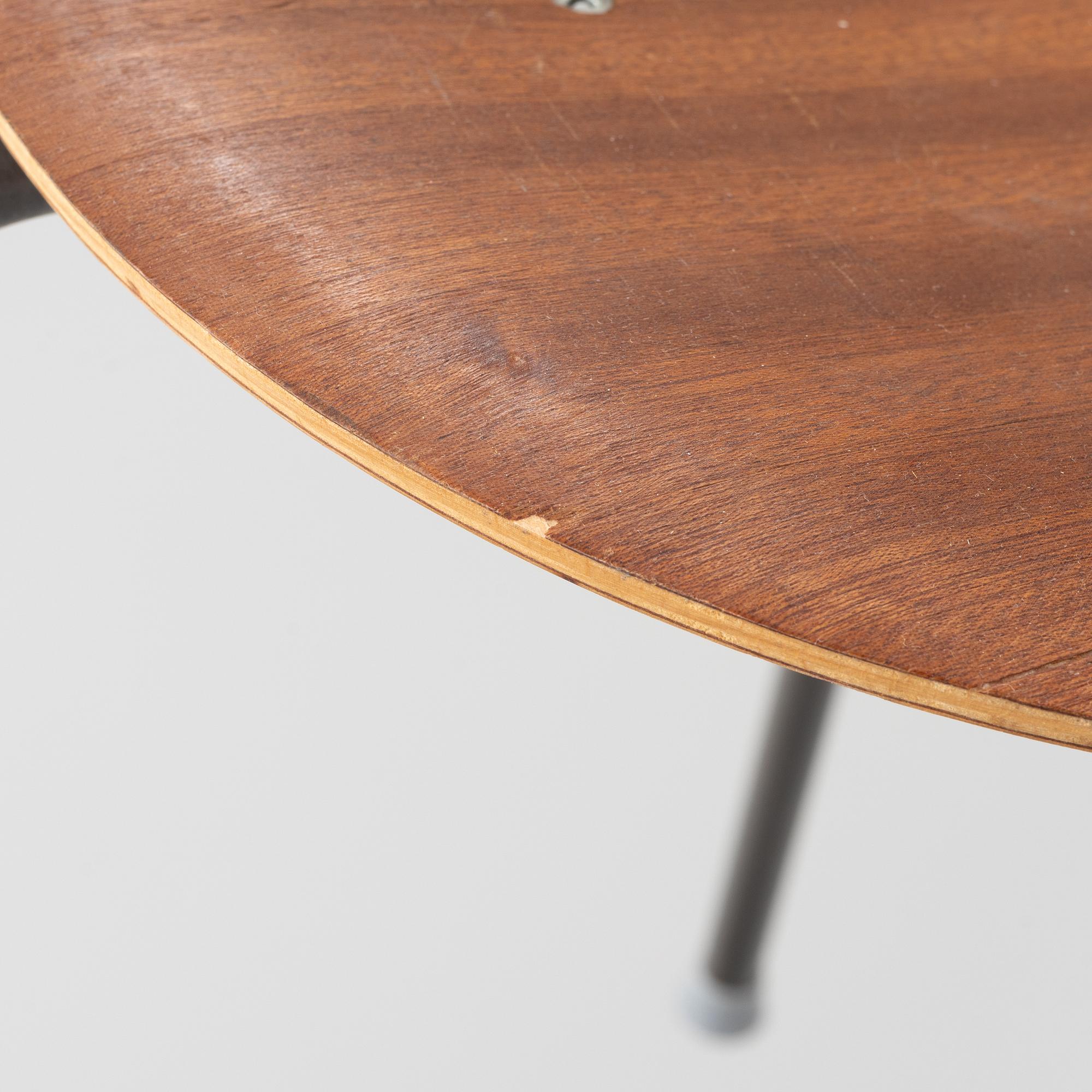 A set of five teak veneered stools, second half of the 20th Century.