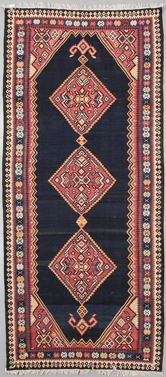 A kelim rug, 342 x 150 cm.