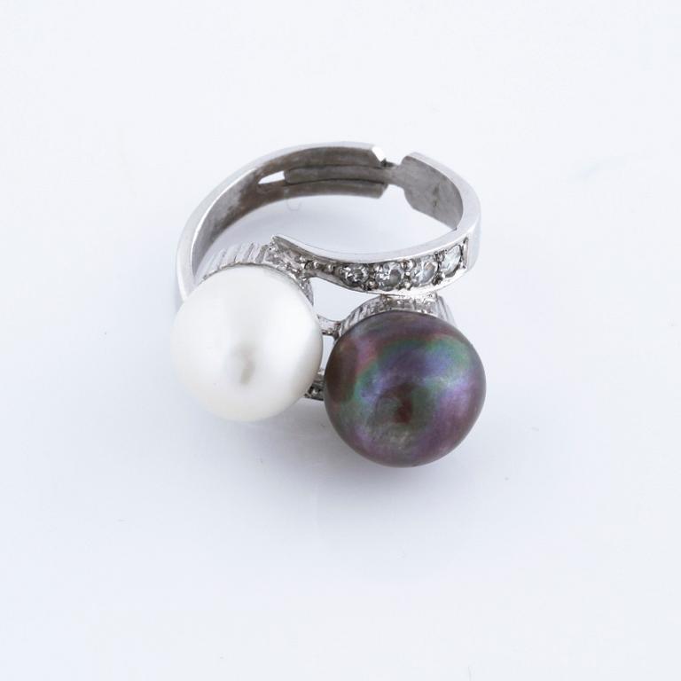 A cultured pearl and single cut diamond ring.