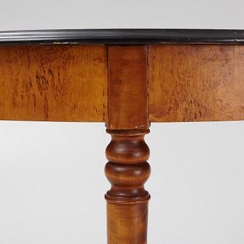 A birch veneered dining table, second half of the 19th Century.