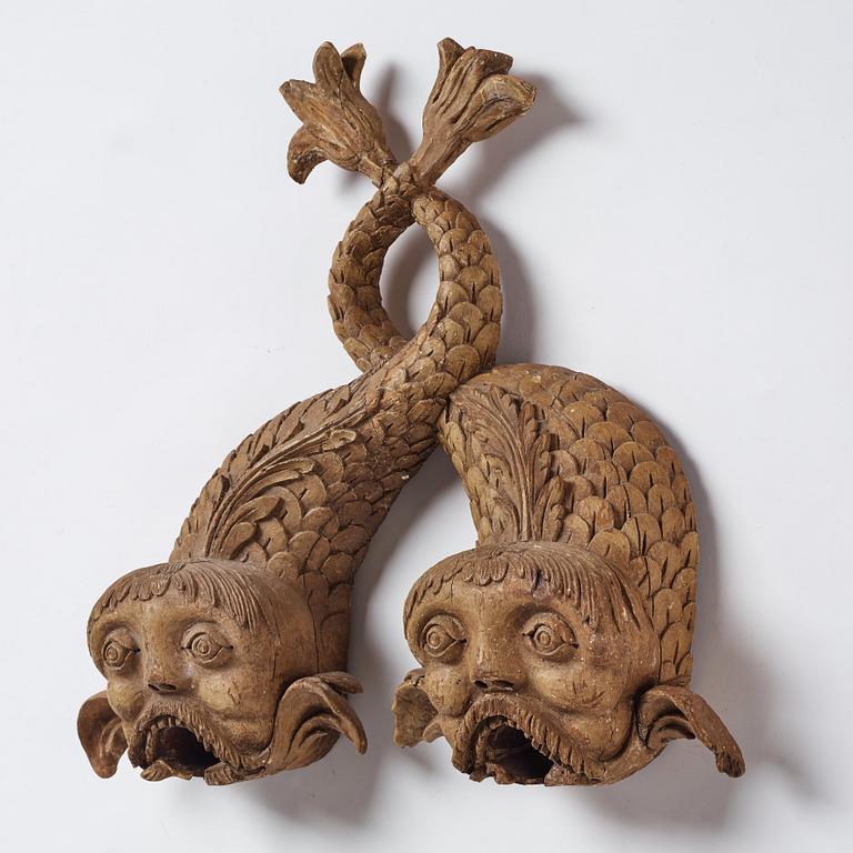 A pair of wooden beer dolphins, circa 1800.