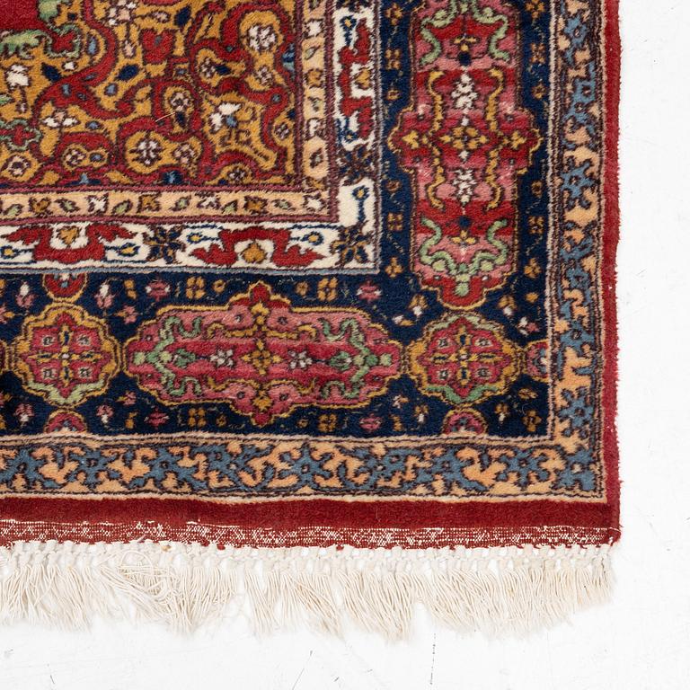 An oriental rug, c. 245 x 150 cm.