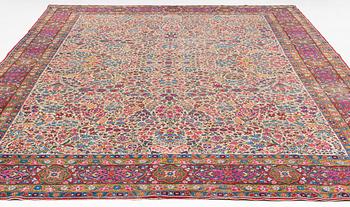 An antique 'Millefleur' Kerman Laver carpet, ca 434 x 321 cm.