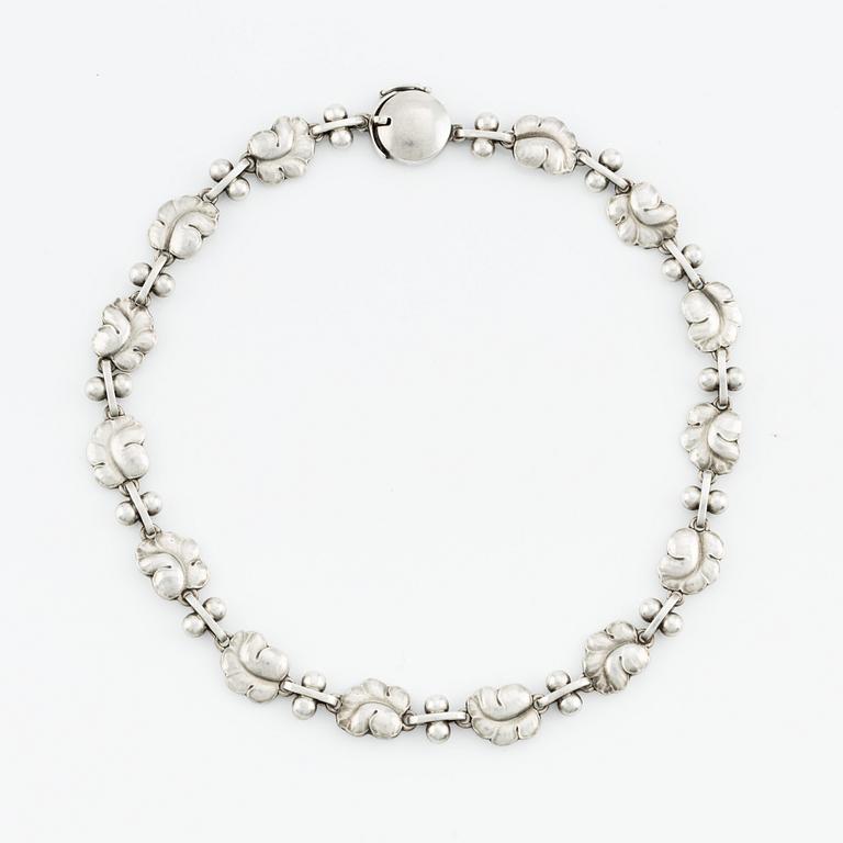 Harald Nielsen, a sterling silver necklace, a brooch, and a pair of earrings, for Georg Jensen, Denmark post 1945.