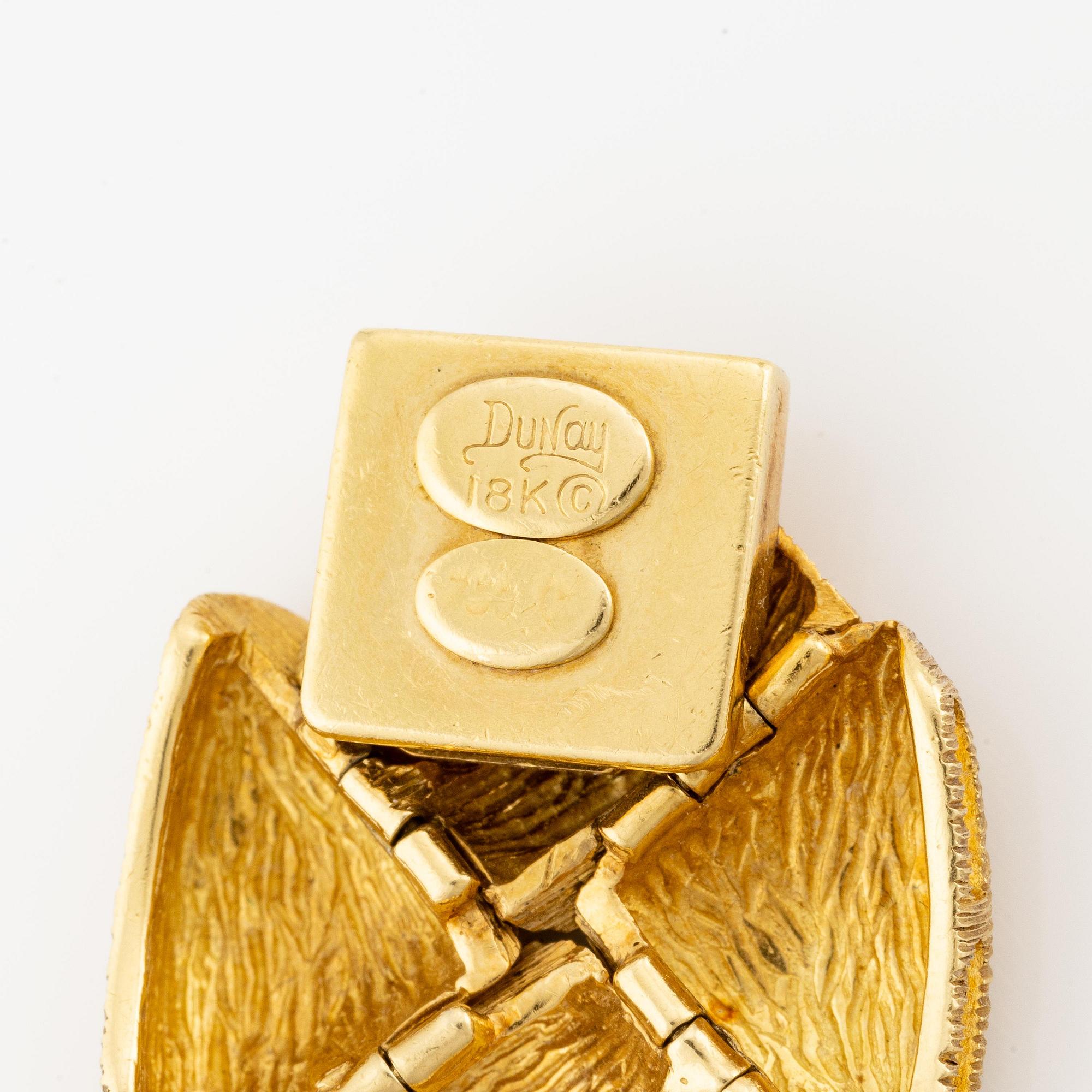 An 18K gold bracelet by Henry Dunay.