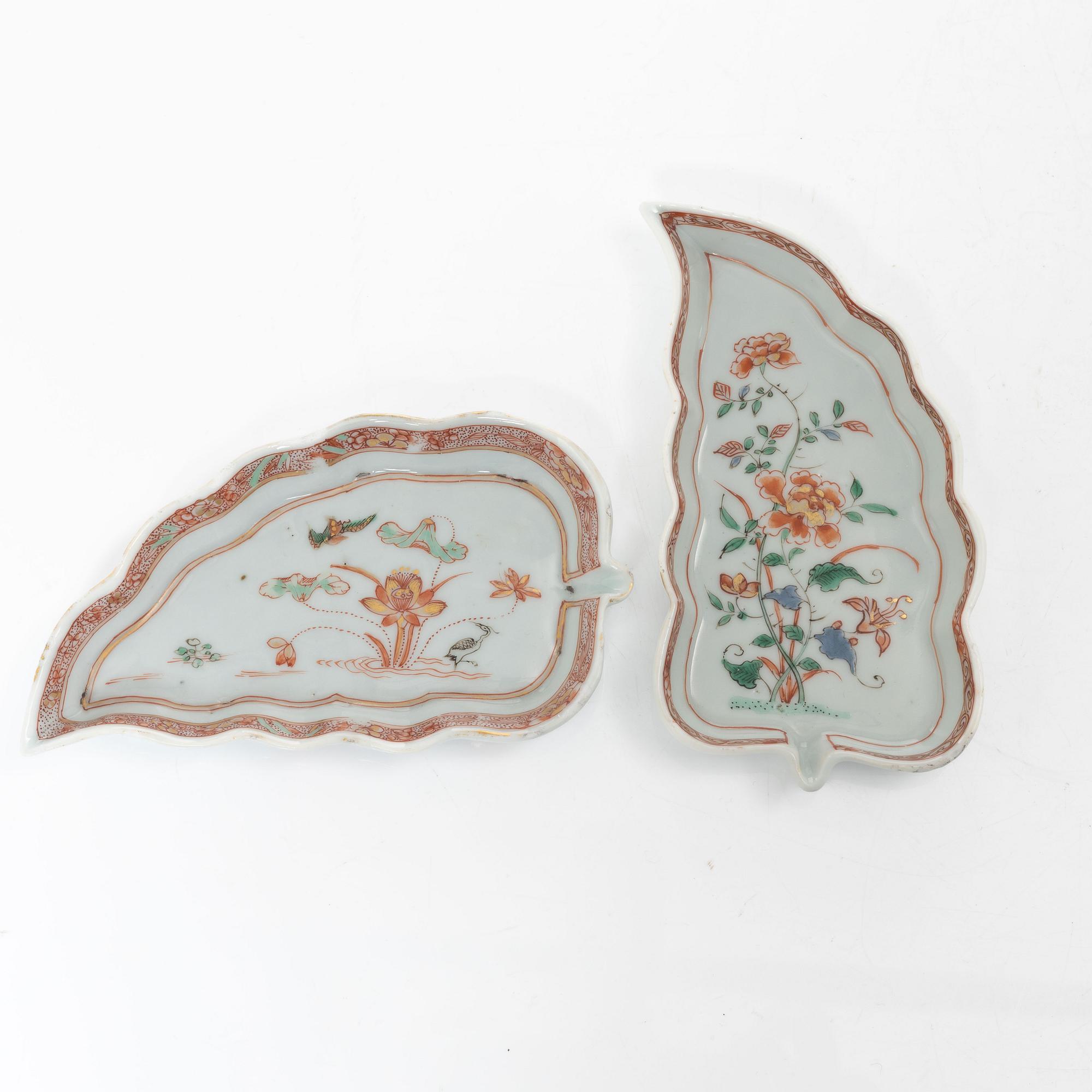 A pair of Chinese famille rose teacups with saucers and a pair of plates and two dishes, Qing dynasty, 18th century.