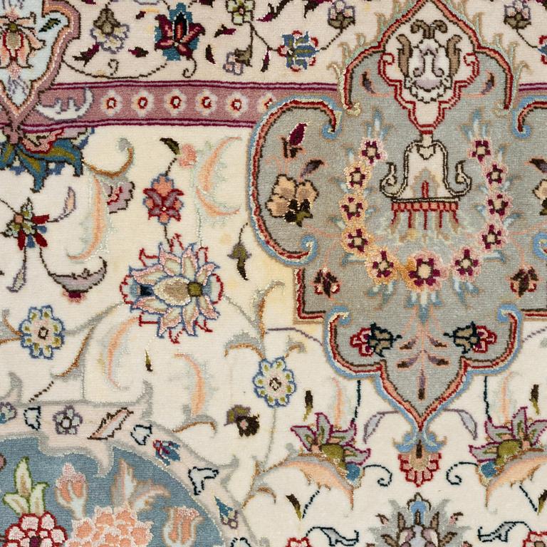 A Tabriz, carpet, 310 x 195 cm. signed.