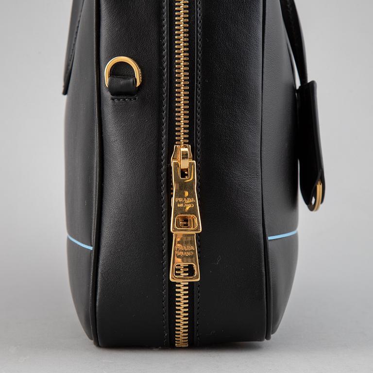 PRADA, a leather bag.