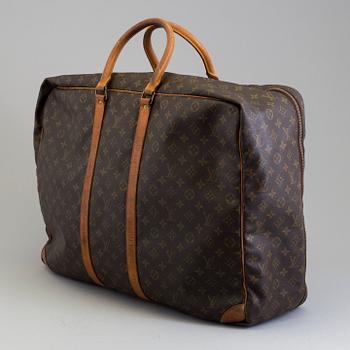 LOUIS VUITTON, a mongram canvas suitcase.