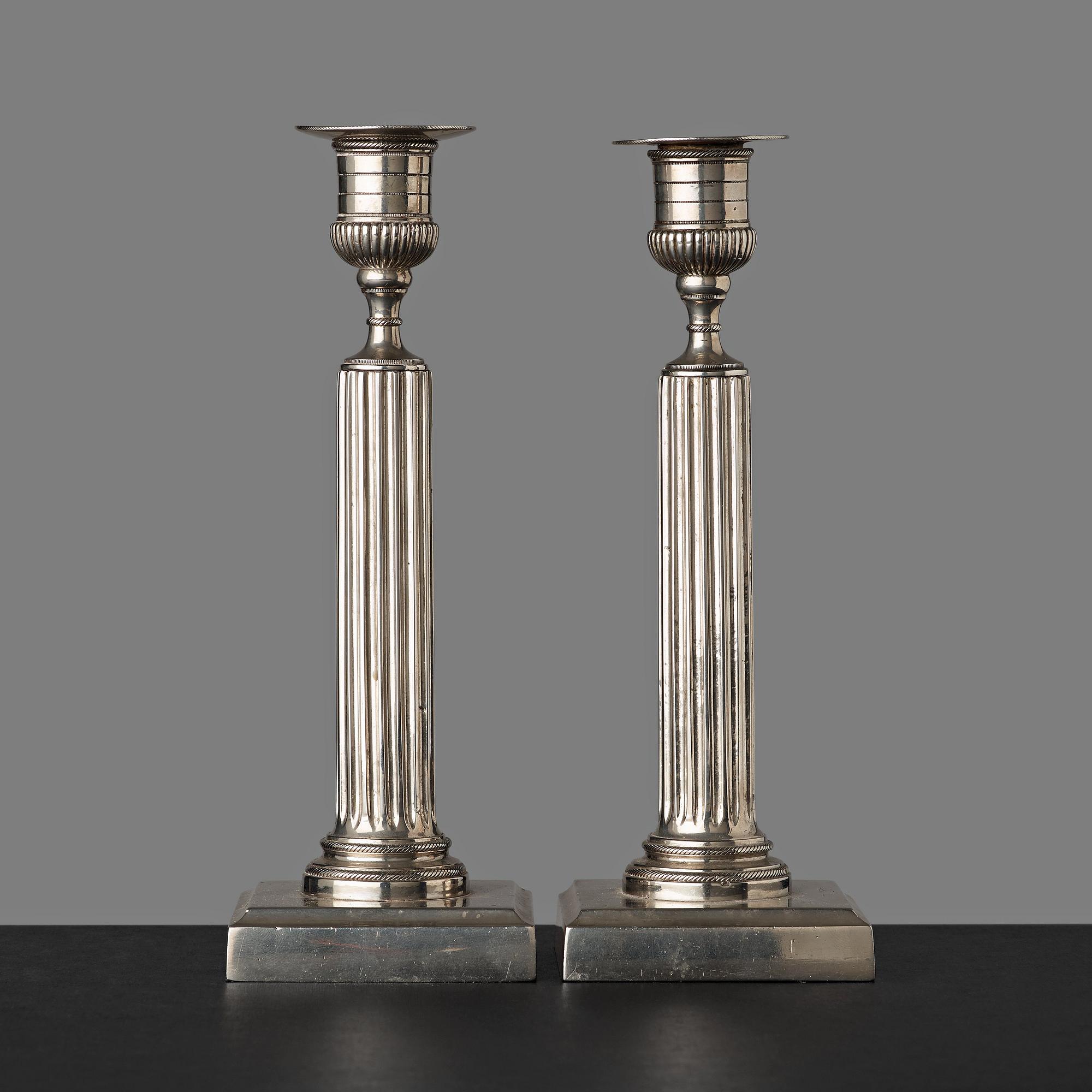 A pair of Gustavian white metal candlesticks by Isak Gråsten (1770-1821), Wedevågs Bruk.