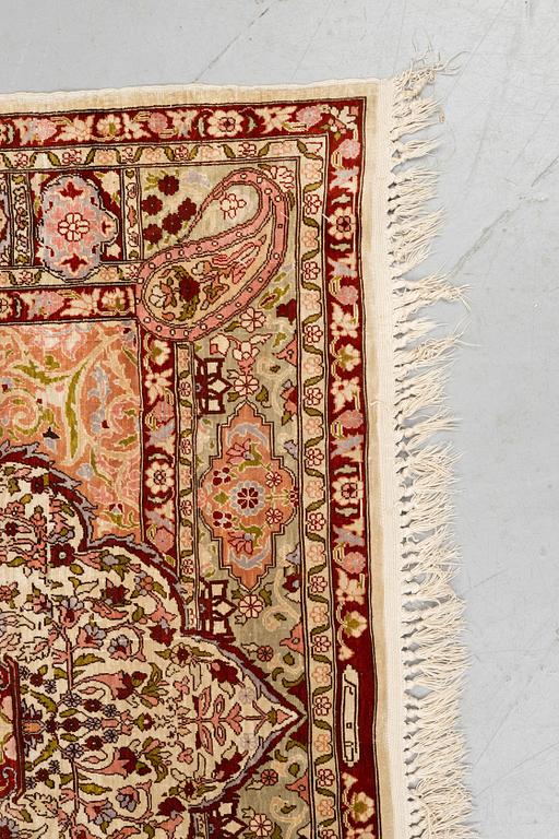 A rug, Old silk Hereke, ca 152 x 110 cm.