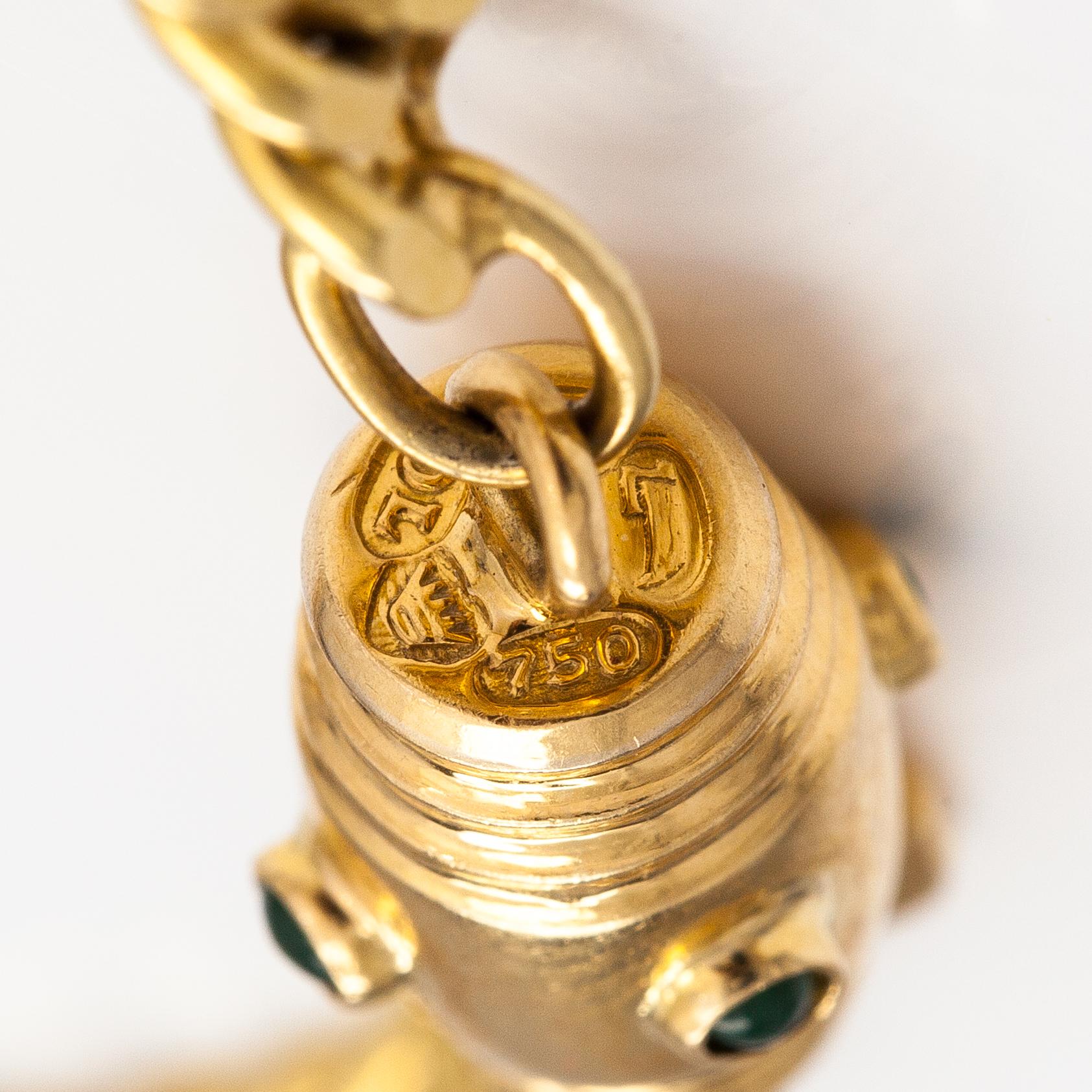 An 18K gold neckalce with stones. Erling Kaj Oy Ab, Helsinki 1977.