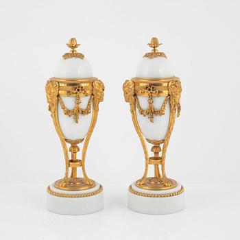 A pair of French Louis XVI-style ormolu and marble cassolettes, later part of the 19th century.