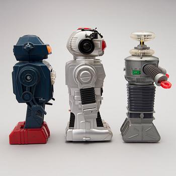 Three Vintage Toy Robots and a Table Clock.