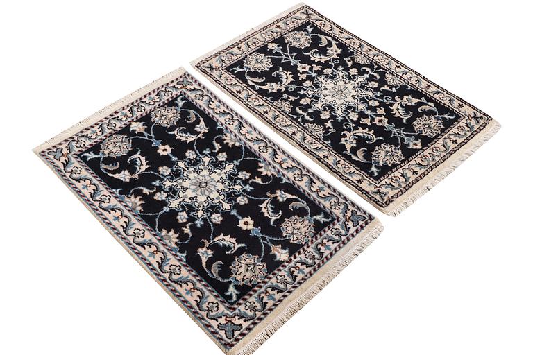 A pair of rugs, Nain, part silk, ca. 89 x 57 cm & ca. 90 x 60 cm.