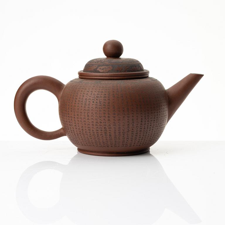 A 'calligraphy' yixing teapot, China, later part of the 1900s.