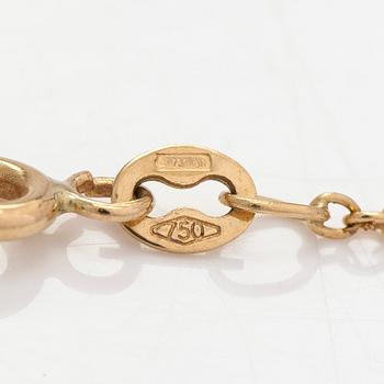 An 18K gold necklace, with a heart-shaped tanzanite and brilliant-cut diamonds.