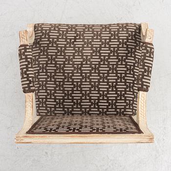 A Gustavian open armchair, Stockholm, late 18th century.