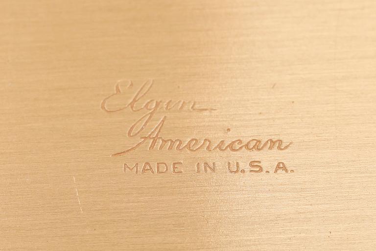 PUDERDOSA, mässing och svart emalj, Elgin, 1900-talets mitt.