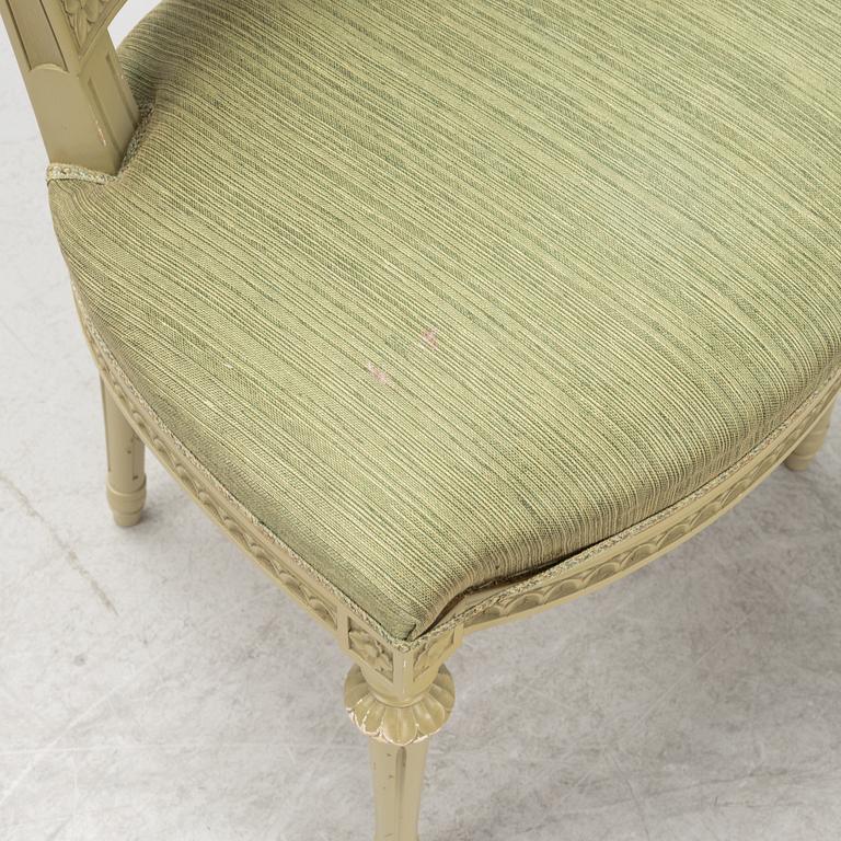 A Gustavian dining table with six chairs. Åmells dated 1974.