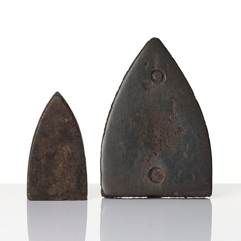 Two cast iron clothes irons, 18th / early 19th century.