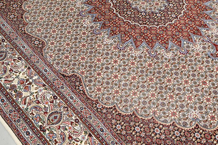 A part silk Moud carpet, approximately 350 x 252 cm.