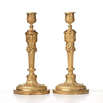 A pair of Louis XVI-style 19th century candlesticks by Raingo Frères, Paris.