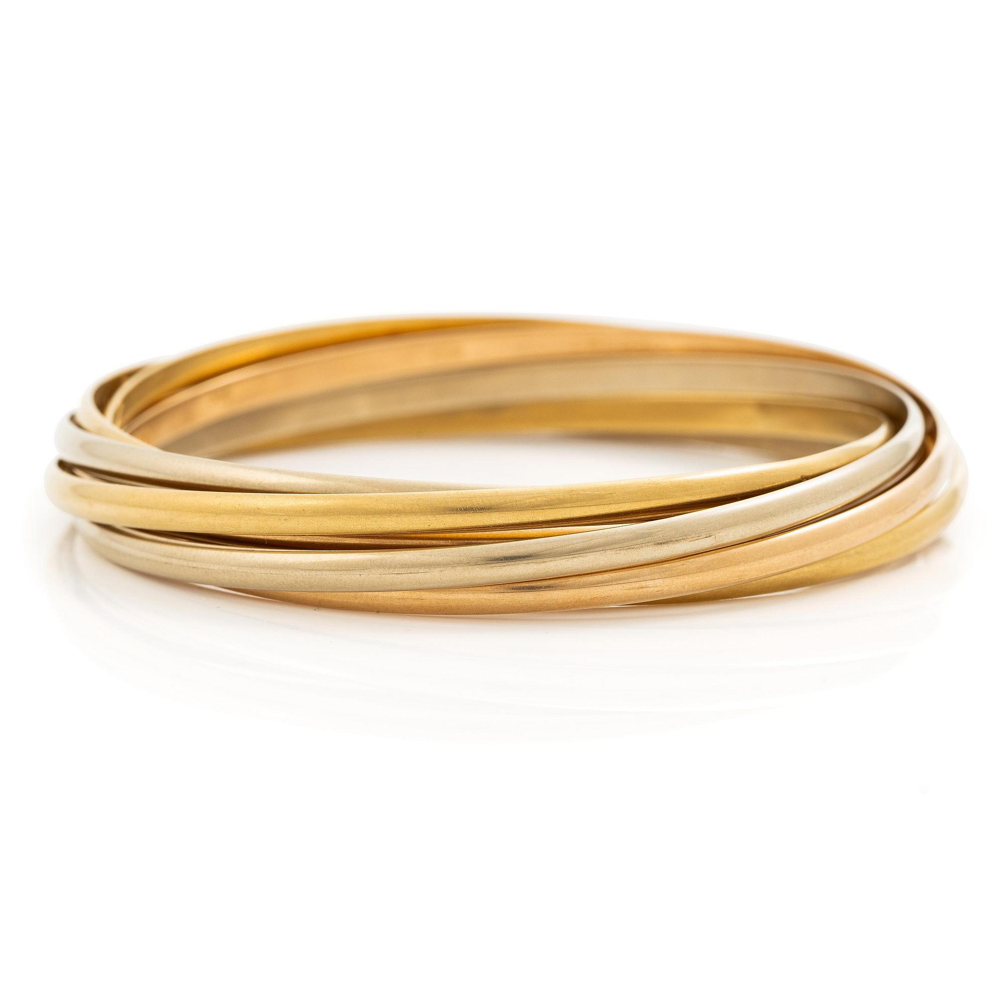 A Cartier bangle "Trinity" 18K gold in three colours.