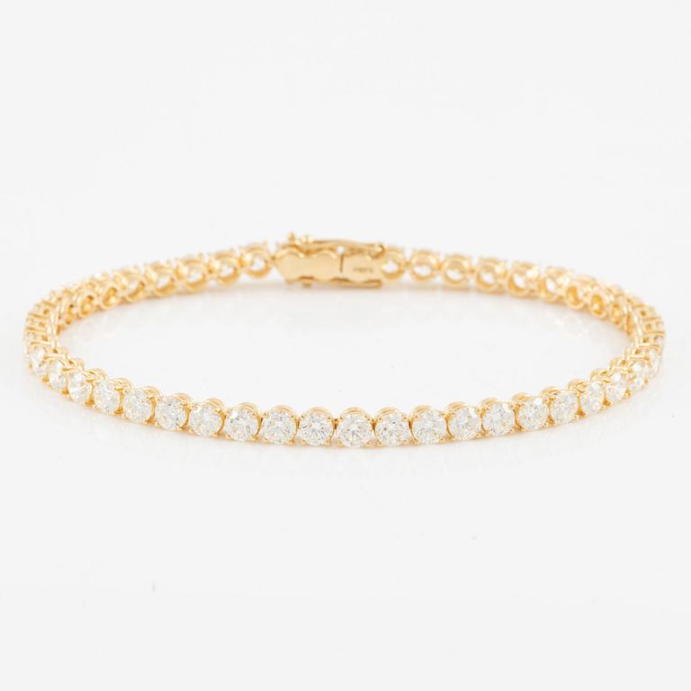 Tennis bracelet, 18K gold with brilliant-cut diamonds.