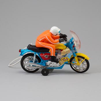 A 1970s battery operated toy racing auto cycle,Original "Junior" Product, Japan.