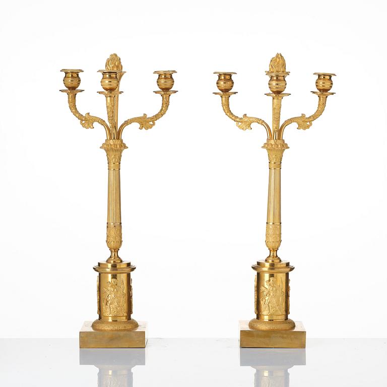 A pair of Empire ormolu three-light candelabra, Stockholm, early 19th century.