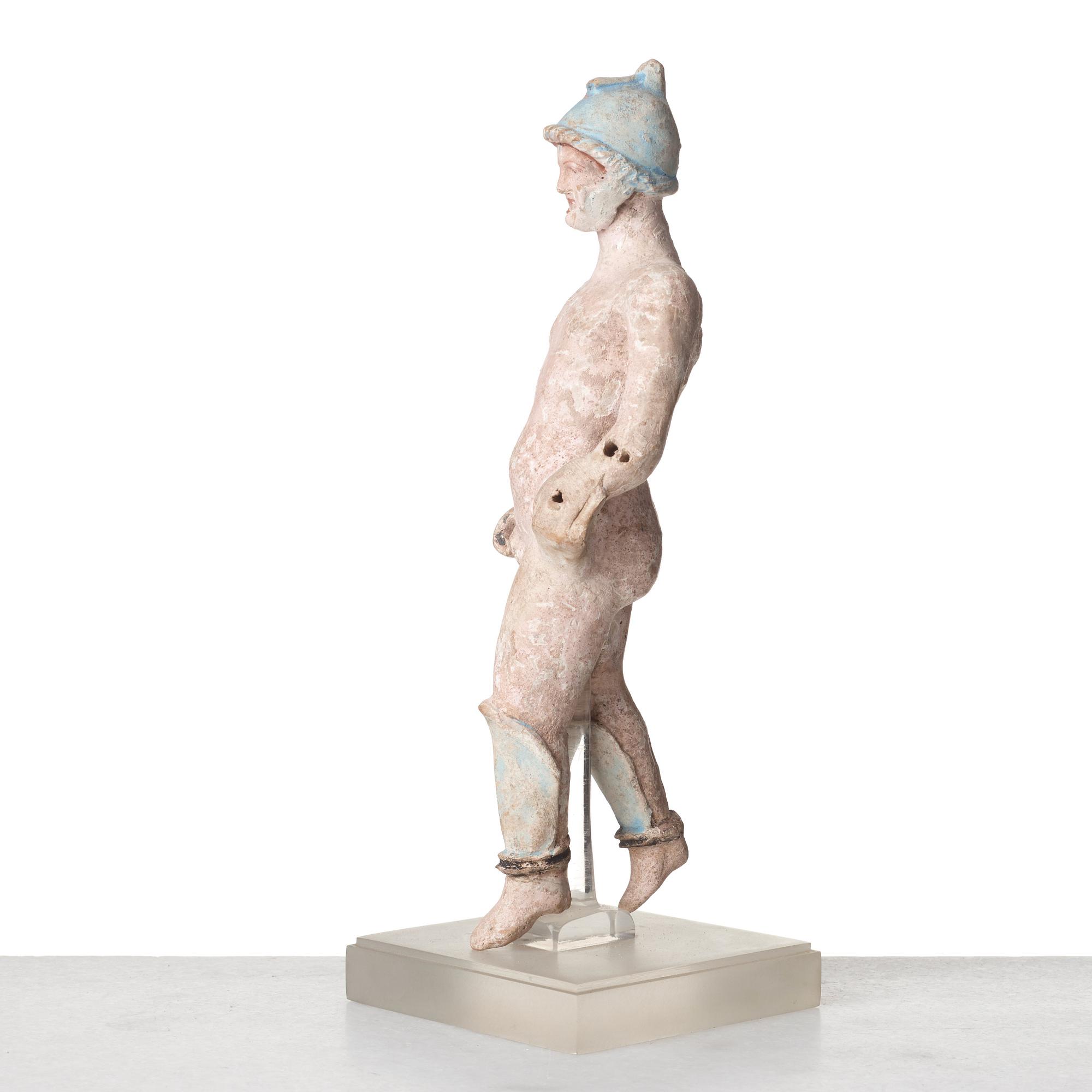 A Greek terracotta sculpture of a warrior, Hellenistic period, Canosa, 3rd Century B.C.