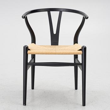 Hans J. Wegner, a model CH-24/'Wishbone' chair, Carl Hansen, Denmark, 21st century.