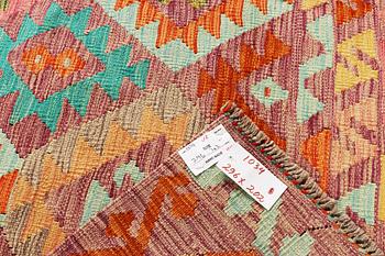 A Kilim carpet, c. 296 x 202 cm.