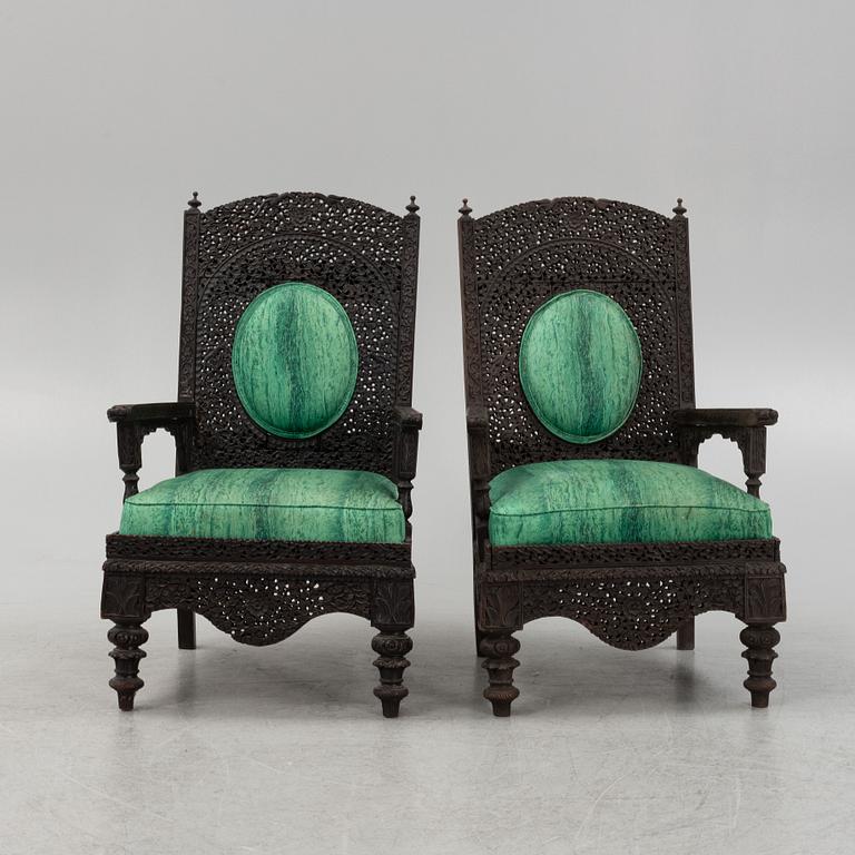 A pair of Angloindian carved chairs, India, 19th century, in so called 'Bombay style'.