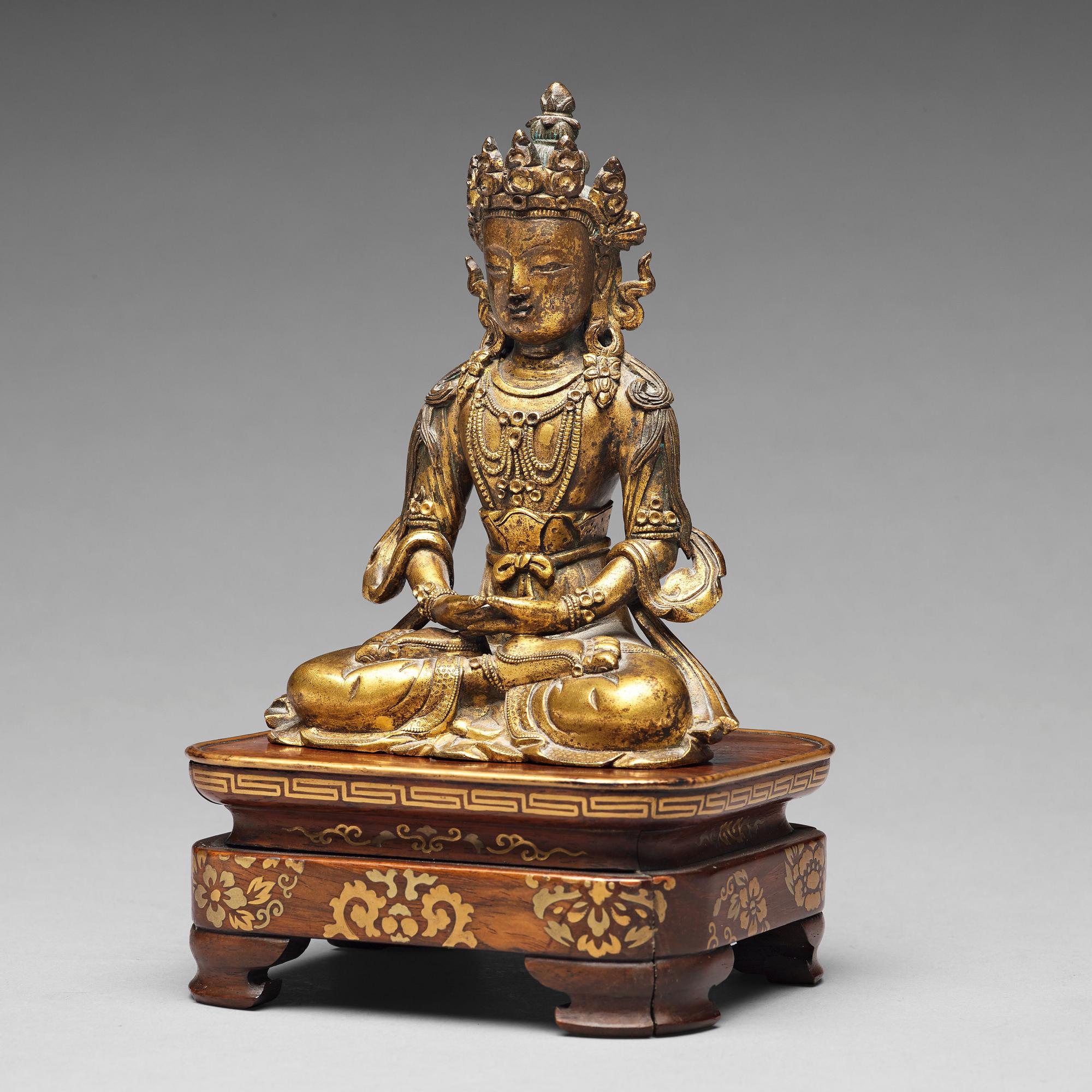 A gilt bronze figure of Amitayus buddha, Tibeto-Chinese, 18th Century.