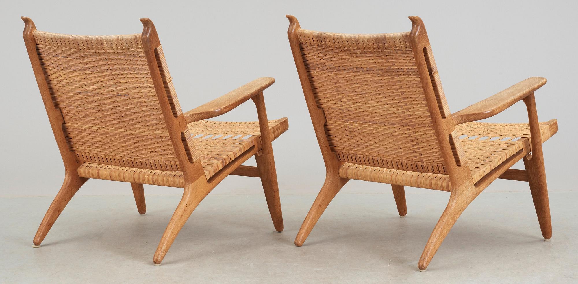 A pair of Hans J Wegner oak and rattan 'CH-27' armchairs, Carl Hansen & Son, Denmark, 1950's-60's.