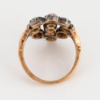 An 18K gold and silver ring set with old-cut diamonds.