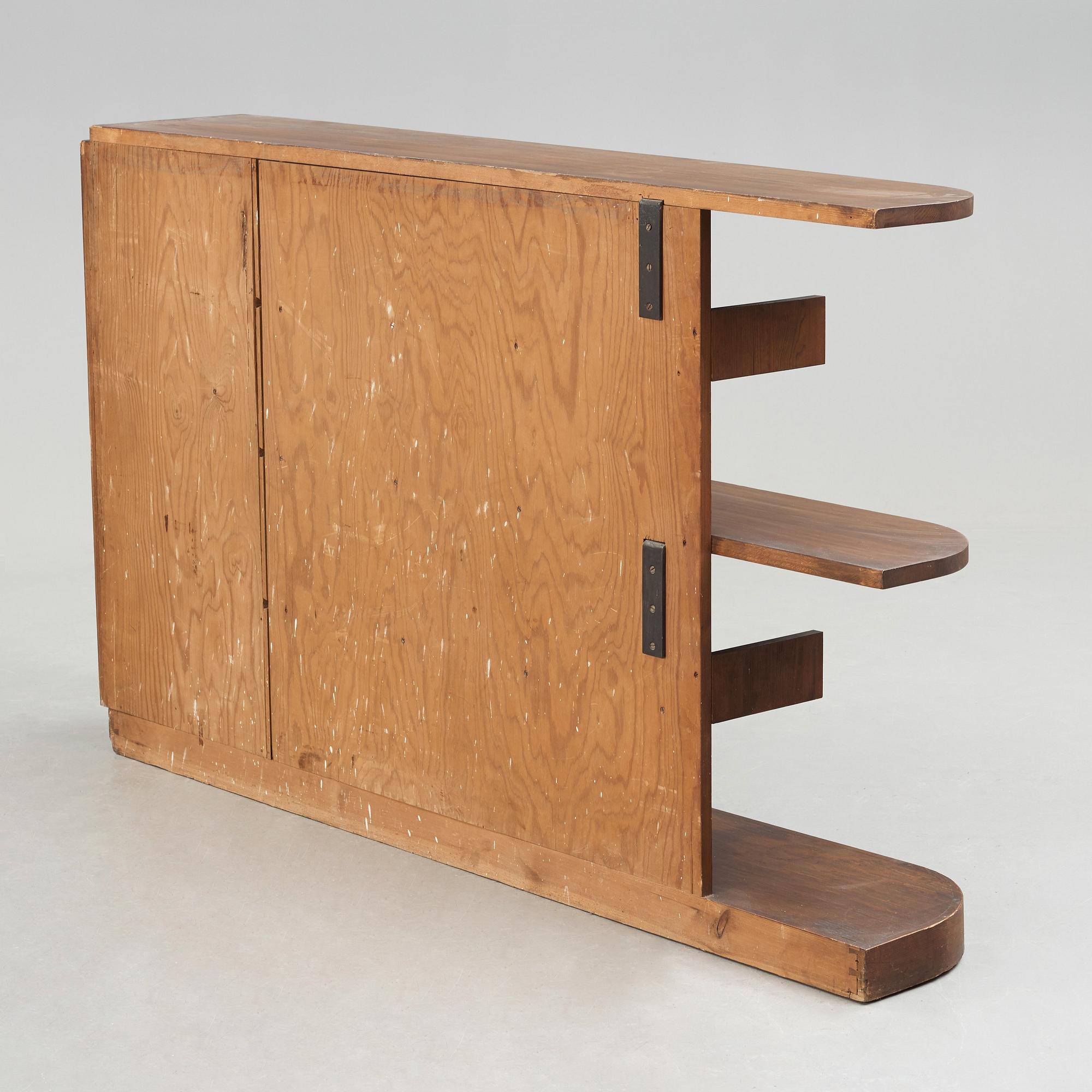 Axel Einar Hjorth, An Axel Einar Hjorth 'Lovö' stained pine bookshelf, Nordiska Kompaniet Sweden 1930's.