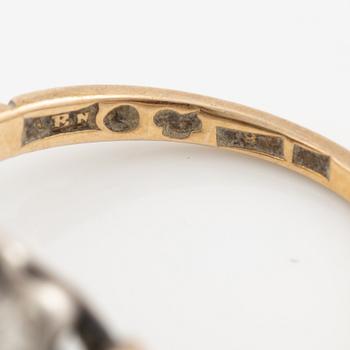 Ring 18K gold and silver set with old-cut diamonds and green stones.