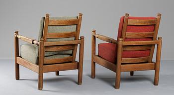 A pair of Axel-Einar Hjorth stained pine armchairs 'Sandhamn' by Nordiska Kompaniet ca 1929.