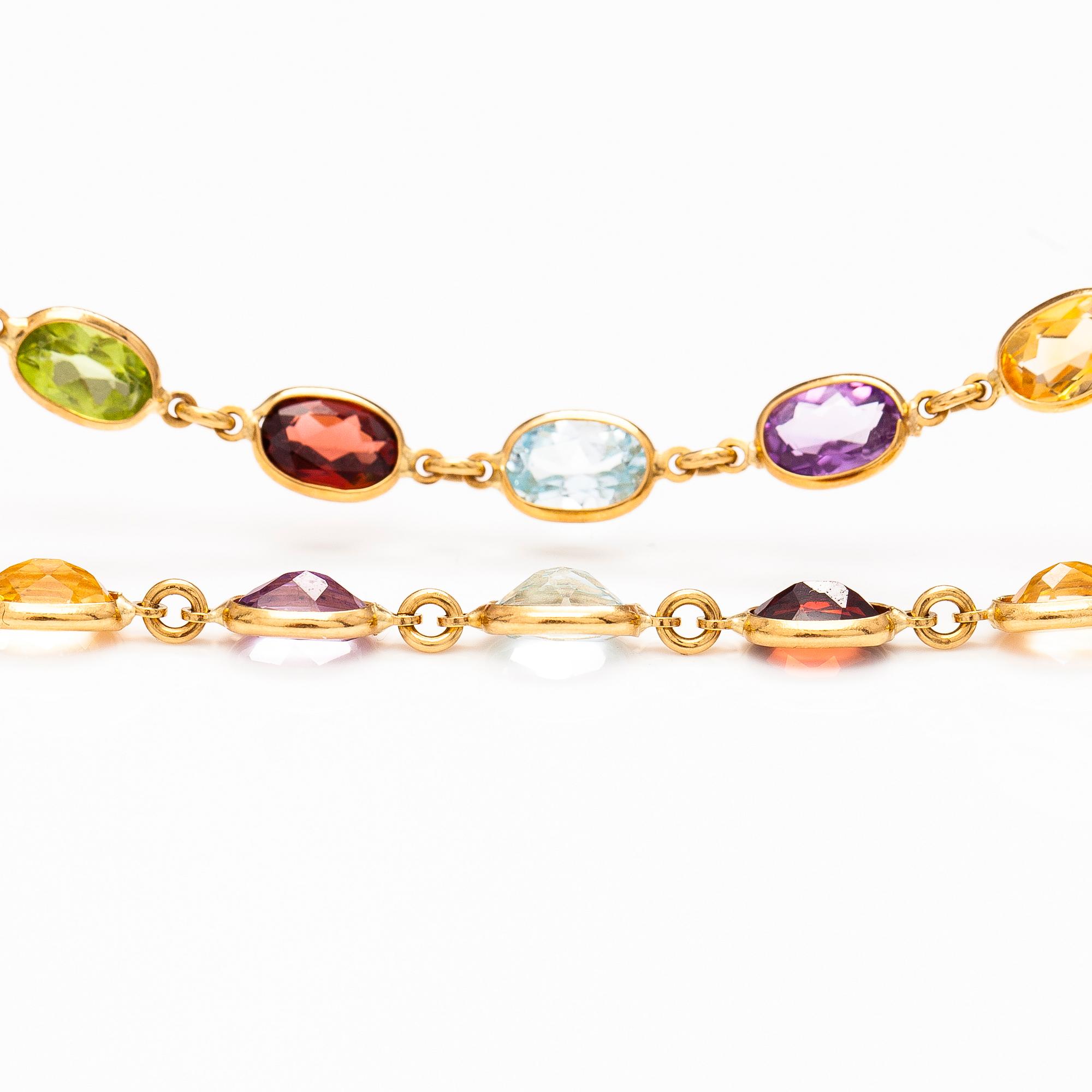 HALSBAND och ARMBAND, 18K guld, granater, peridoter, topaser, citriner och ametister. Le-Gi, Italien.