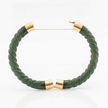 Arm ring, green stone and clasp in 14K gold.