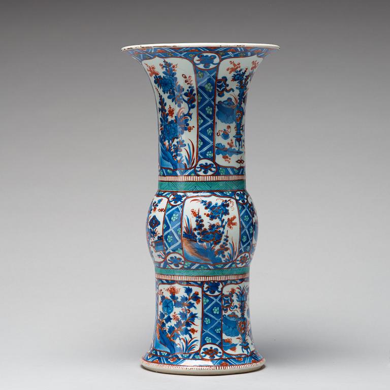 A blue and white 'Clobbered' vase, Qing dynasty, Kangxi (1662-1722).