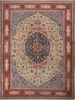 A CARPET, a semi-antique Tabriz, around 422 x 310 cm.