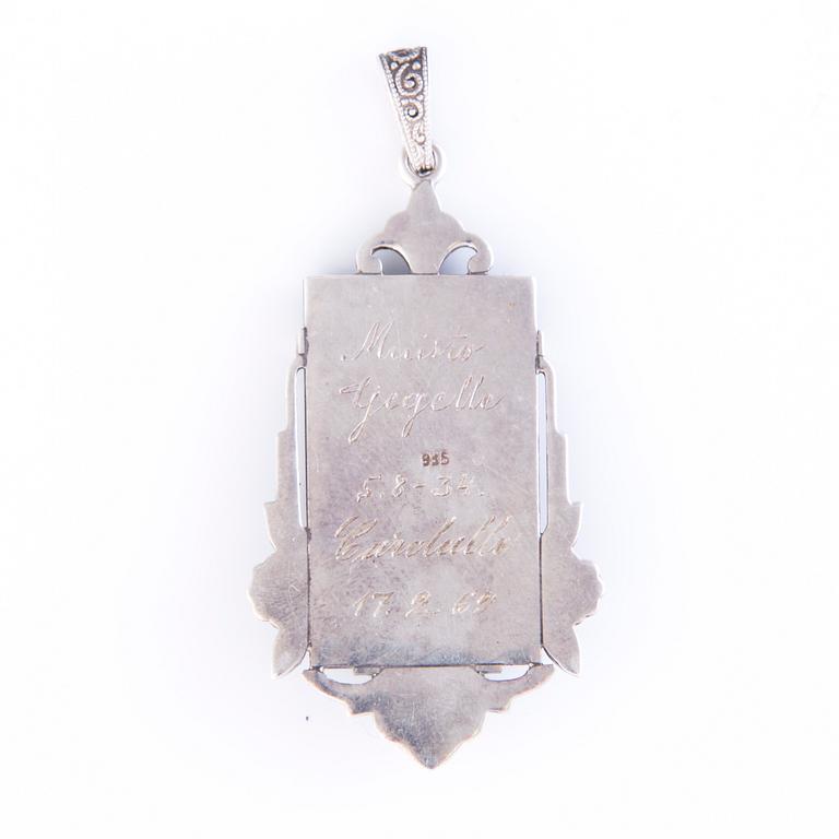 Four Art deco jewelry, ring, pendant necklace and earrings in silver.