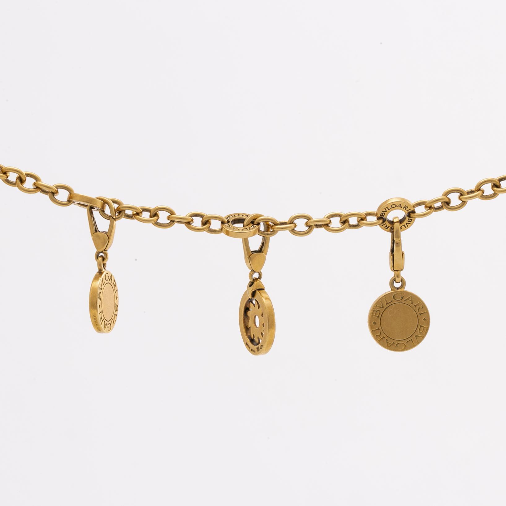 BVLGARI BRACELET w 5 charms (detachable), 18K gold and whitegold, onyx, mother-of-pearl, brilliant-cut diamonds 0,20 ct.