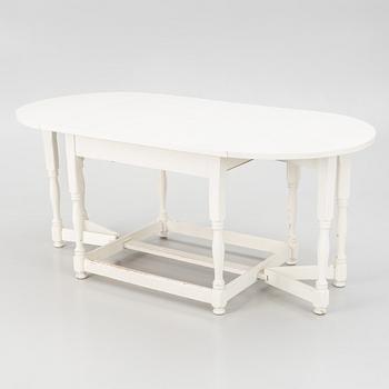 An early 20th century drop-leaf table.